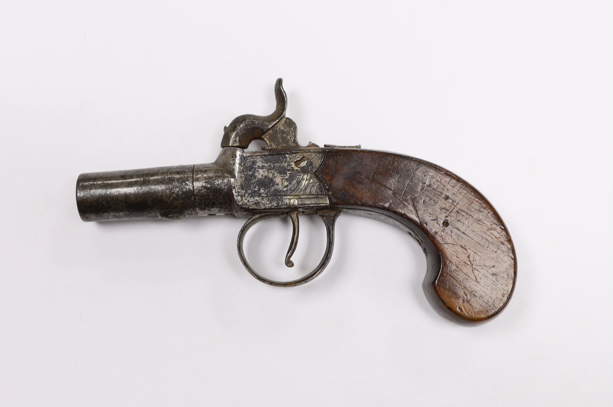 A 19th century box lock percussion pocket pistol with turn off barrel, engraved frame slab and walnut grip, barrel 4.2cm